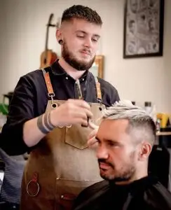 image of a barber cutting a mans hair in Vogue Hair & Barbers