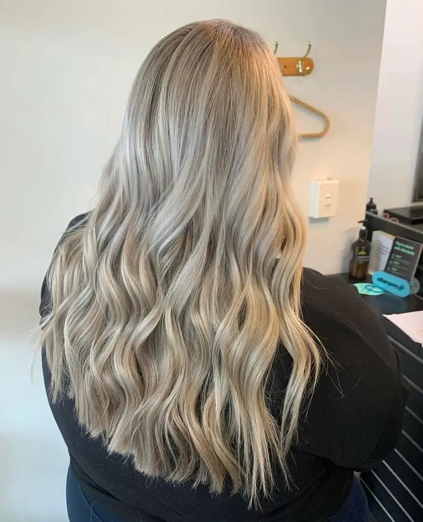 image of a womans blonde hair freshly done in Vogue Hair & Barbers