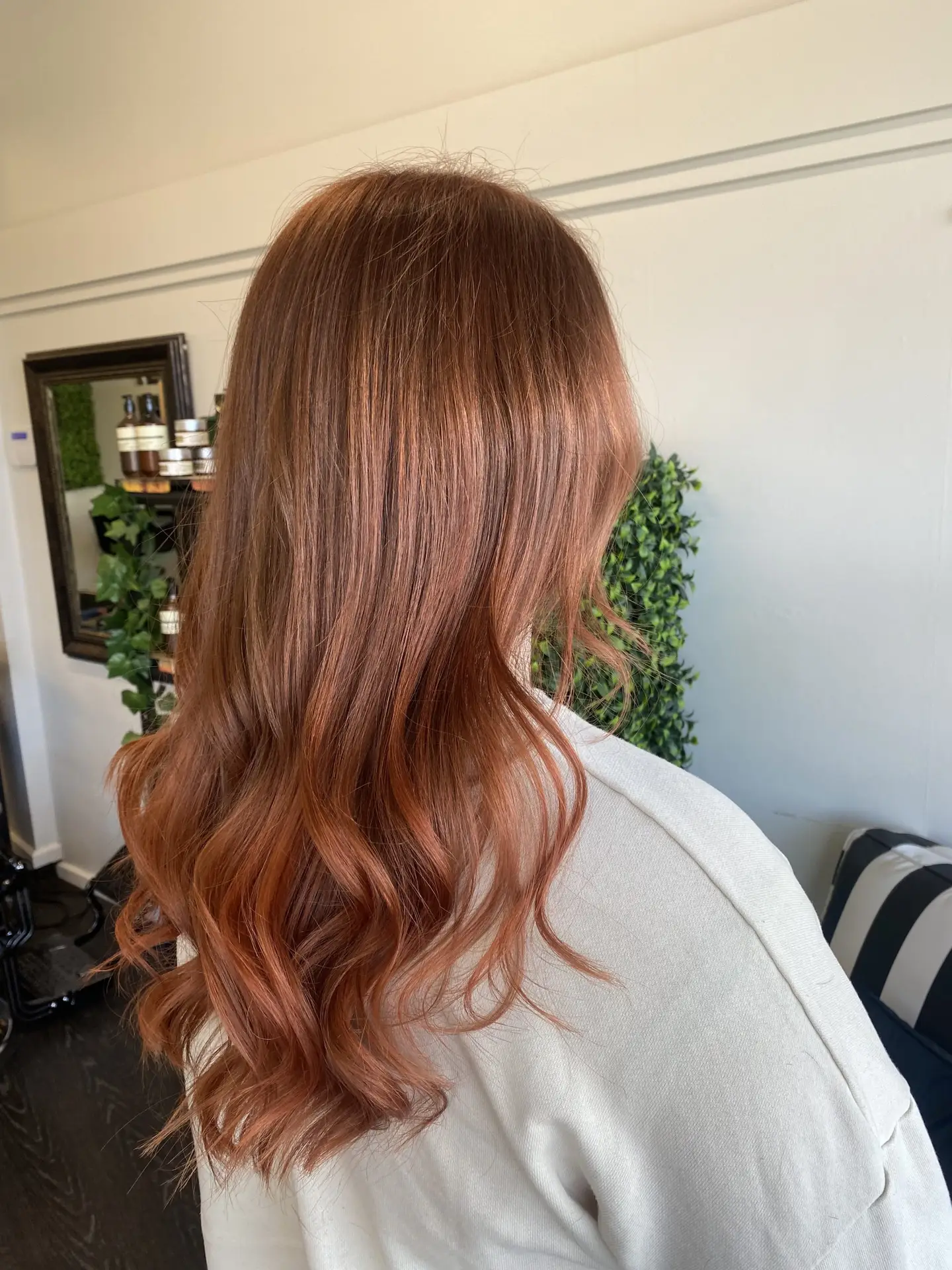 image of a womans copper hair freshly done in Vogue Hair & Barbers