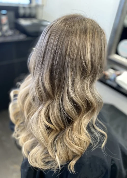 image of a womans blonde hair freshly done in Vogue Hair & Barbers