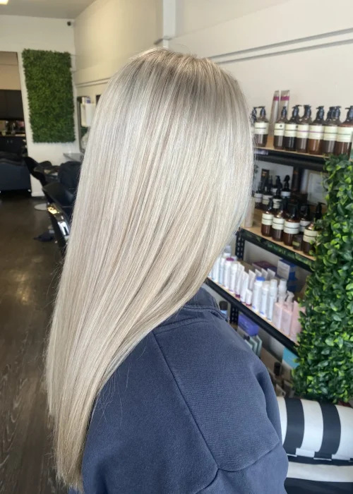 image of a womans blonde hair freshly done in Vogue Hair & Barbers